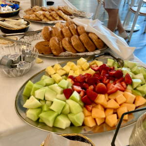 Continental breakfast at Reston National Golf Course featuring pastries, muffins, fruit, and coffee set up for guests, highlighting morning dining and event hospitality.