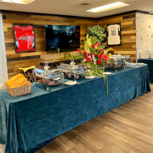 Holiday party buffet at Reston National Golf Course, featuring a variety of festive foods and dishes arranged on a serving table for guests.